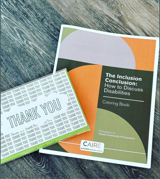 The green, orange, and grey cover of the coloring book (letter sized) called "The Inclusion Conclusion: How to Discuss Disabilities" is laying flat on a table. 